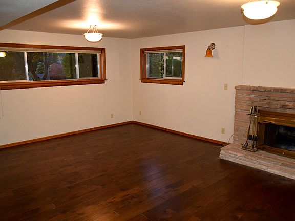 Lower level family room with wood burning fireplace.