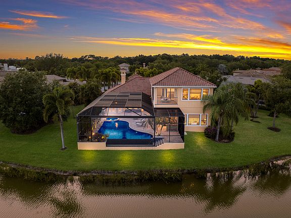 Premium oversized lot with lake & golf course views