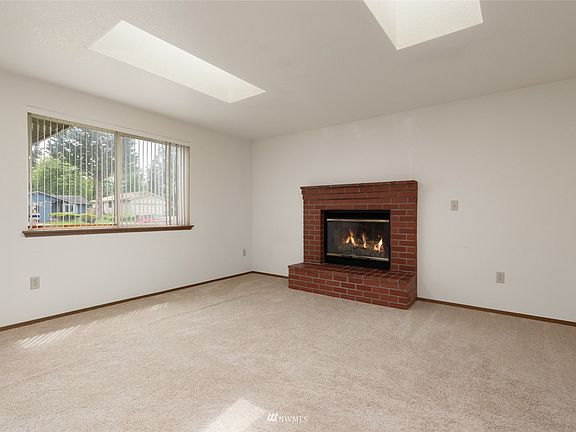  picture window and skylights add a fresh and light and bright feeling to the room to enjoy year round 