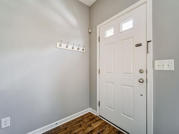 Entrance door with coat-hooks and small front coat closet