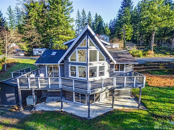 Gorgeous floor to ceiling windows facing the lake allow you to enjoy the view from almost every room in the house!