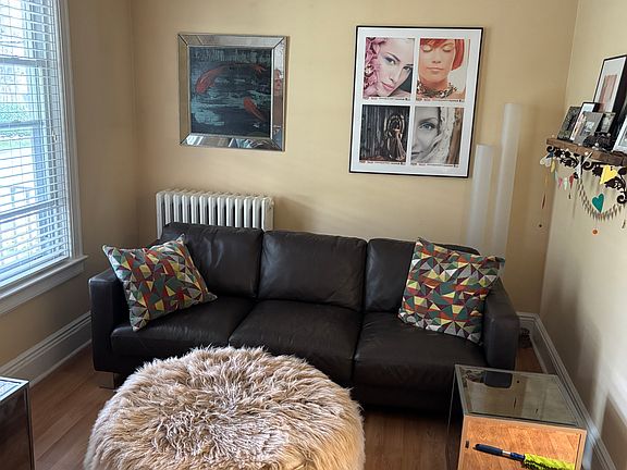 Living room with furniture from previous tenant. Living room is now vacant