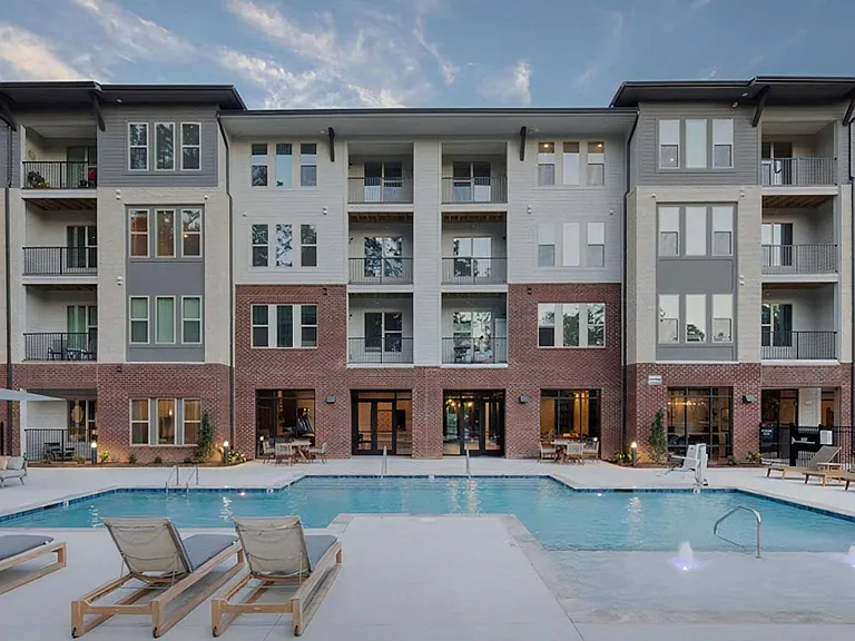 Broadstone Trailside Dramatic Pool with Fountain Features and Modern Lounge Chairs