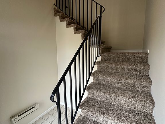 Stairs leading to living room on second floor.