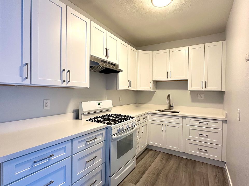 NEWLY REMODELED KITCHEN - WHITE QUARTZ COUNTERS, WHITE SHAKER CABINETS, NEW APPLIANCES