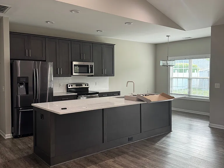 At front door looking at kitchen and dining area.