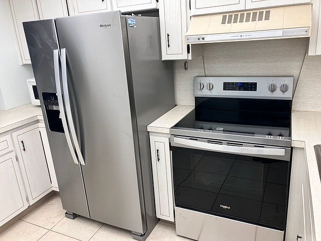 The kitchen features new appliances.