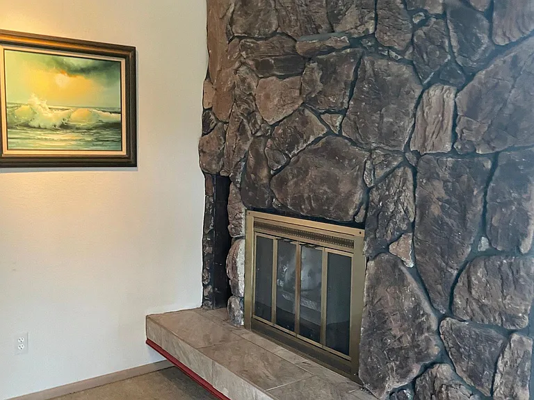 Pre-remodel F/P pic shows truer colors..rocks look faded