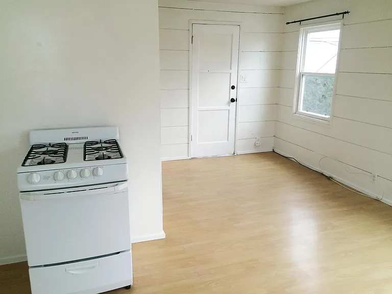 View of entry door from kitchen area