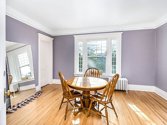 The mirror and table are no longer in this room. It is a beautiful additional space to the main living area with sunlight that fills the home!