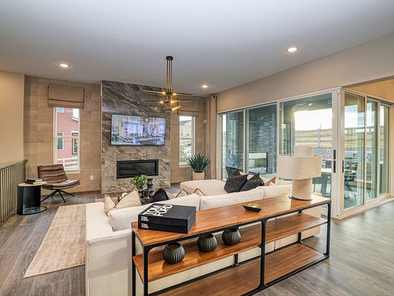 Enhance the gathering room with the corner sliding glass door upgrade to seamlessly transition to th