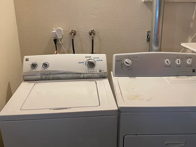 Washer dryer located in attached two car garage