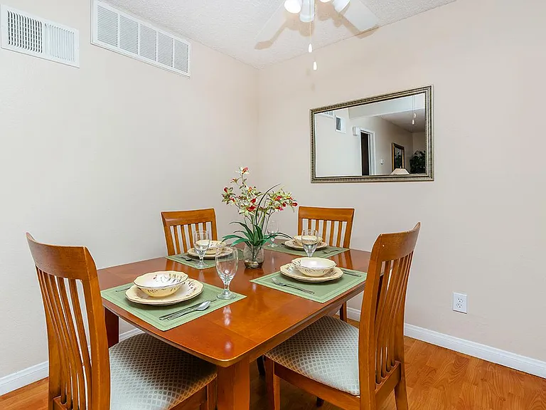 COMFORTABLE DINING ROOM WITH CEILING FANS