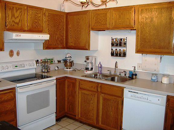 Kitchen has been updated with tile floors and newer appliances