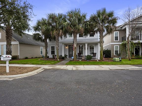 Garage in back and accessible from private road.