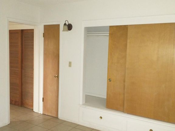 Bedroom closet, coat closet and linen closet from bedroom.
