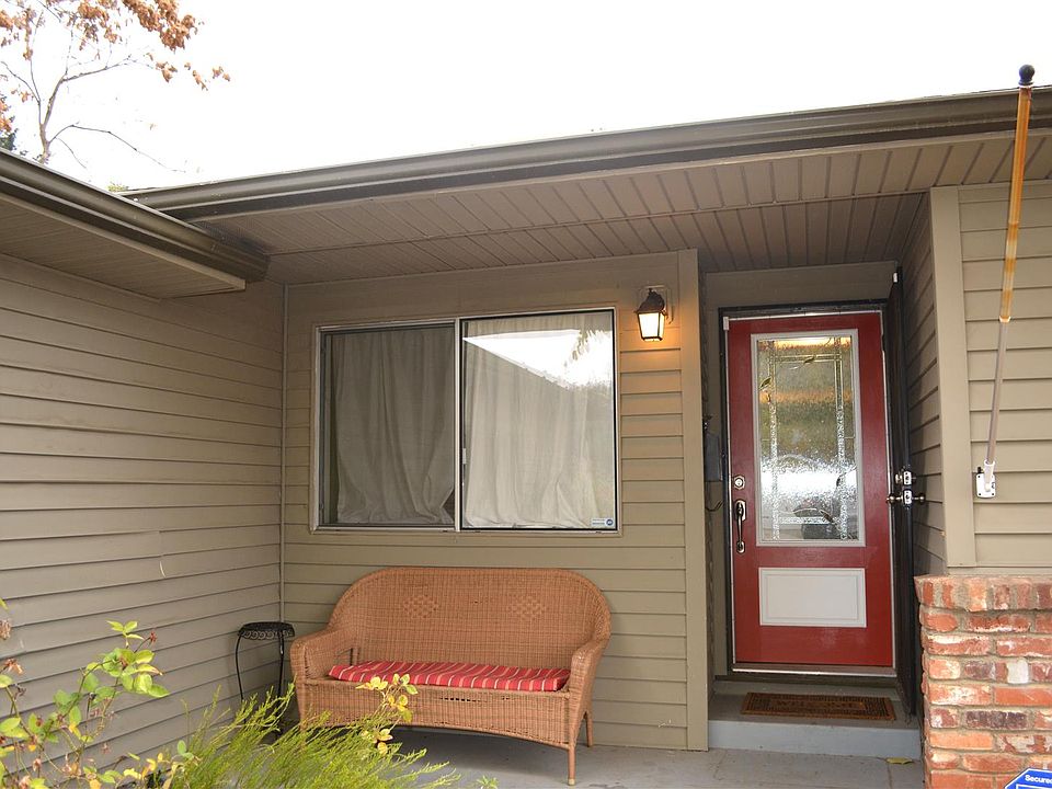Family home with tons of curb appeal and a red doo