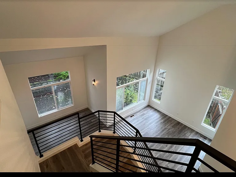 Stairs view from 2nd floor to living and dining area