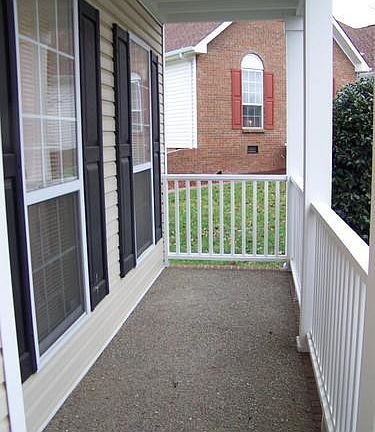 The covered porch outside the front door.
