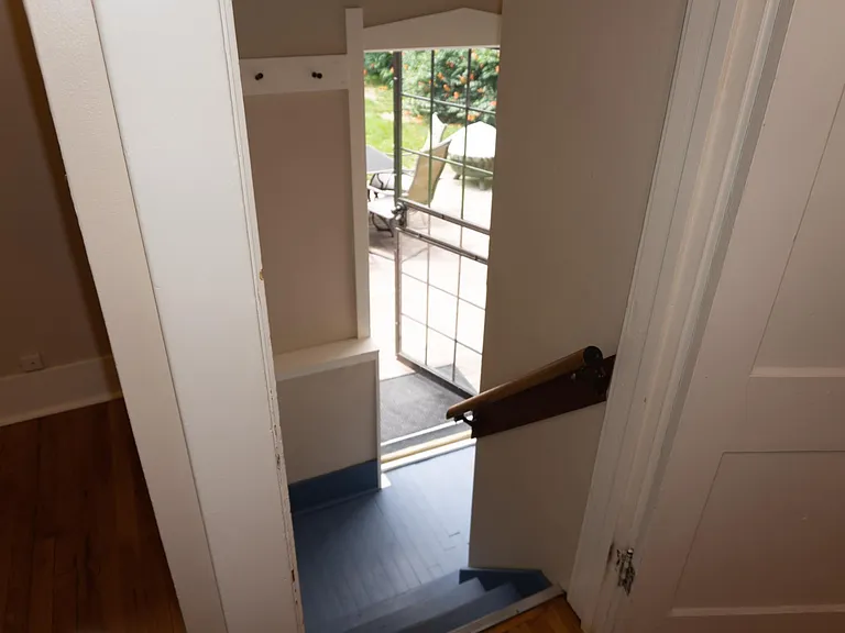 Looking down the stairs to the back door landing.
