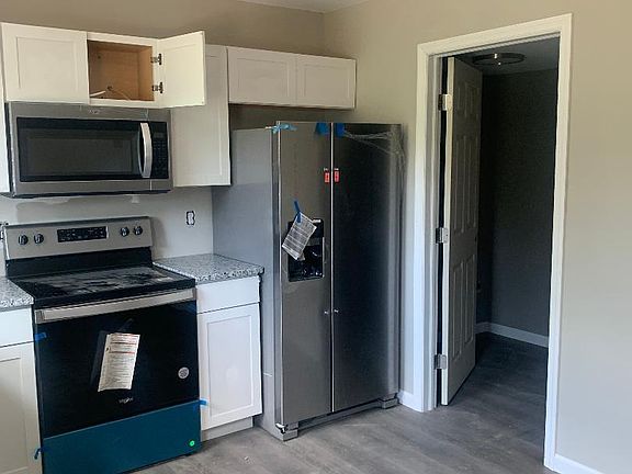 Kitchen area, laundry and half bath off off kitchen