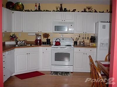 This kitchen has it all, great counter space plus a microwave over the cooking stove.