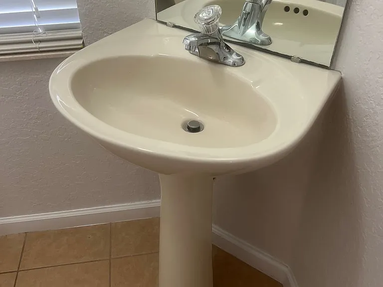 69 - Guest bathroom with pedestal sink and ceramic floor.