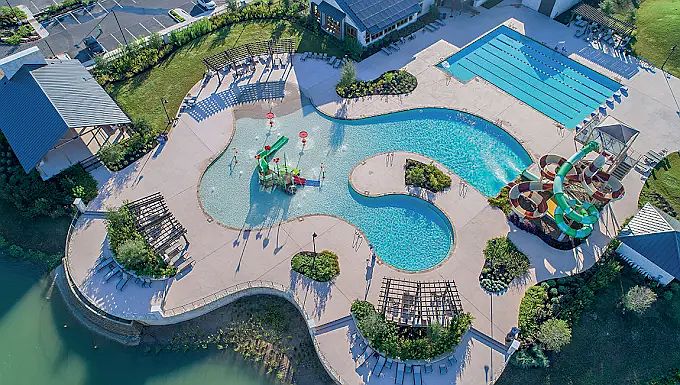 resort style pool with separate lap pool and large double water slide.