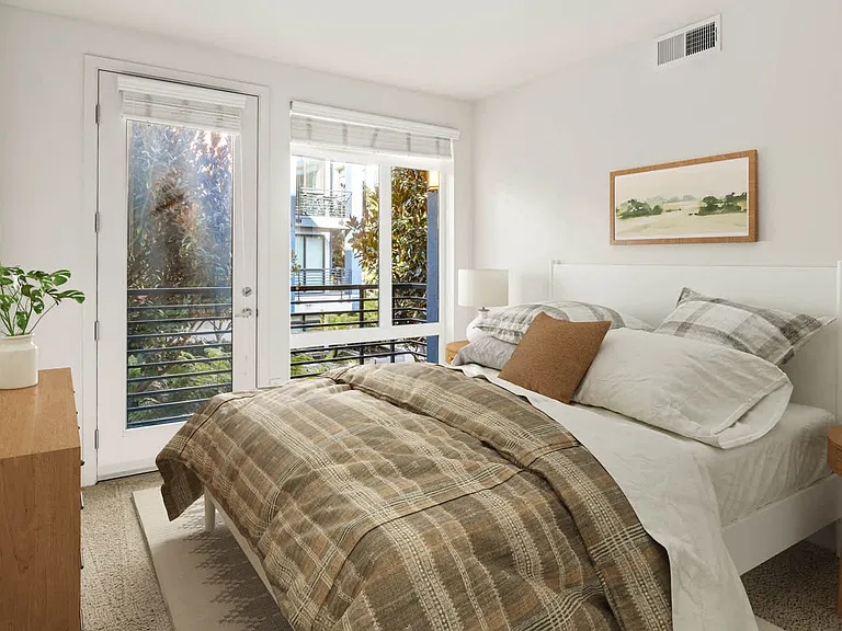 Carpeted Bedroom with Balcony