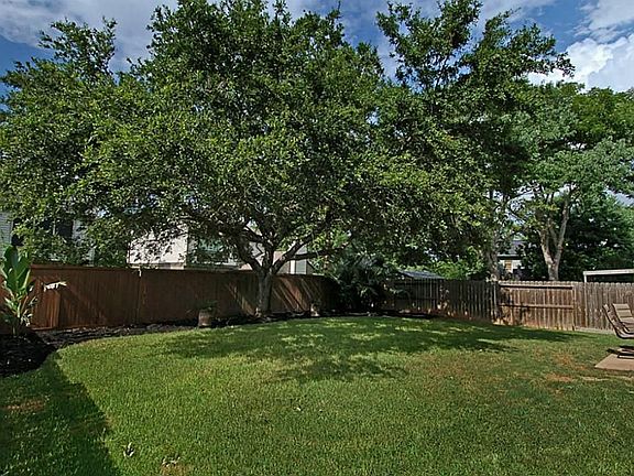 The back yard is plenty big enough for a pool. Meanwhile enjoy the great shade tree and the nice landscaping.