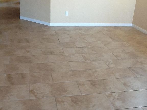 Neutral Tiles in living room and all three bedrooms