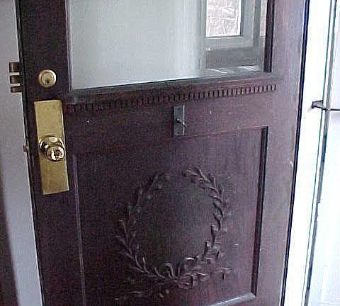 Carved front door.