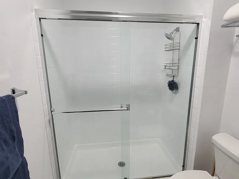 Pristine hall bathroom with dual access_connects seamlessly to the middle bedroom, offering the comfort and convenience of an en suite. ____