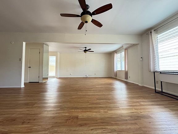 Large living room. Split air conditioning and fans throughout.