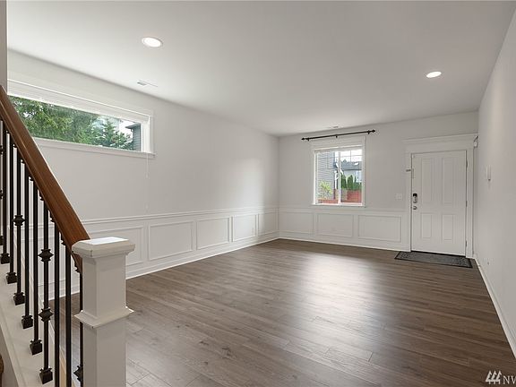 Gorgeous new flooring throughout the main level, bright open living spaces welcome you