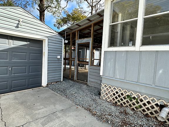 Entrance to porch and back door from the driveway
