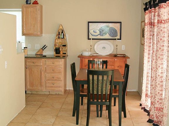 Ceramic tile floor in kitchen, dining area, and living room
