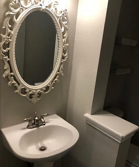Convenient and attractive half bath downstairs.