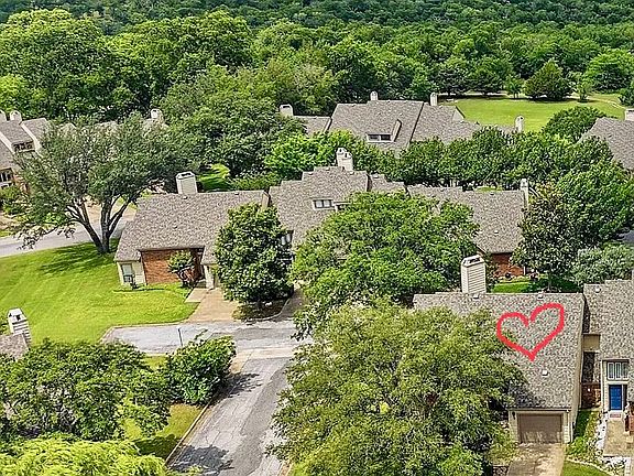 Desirable end unit affords great light. Lake Texoma is so close, you can see it from the property.