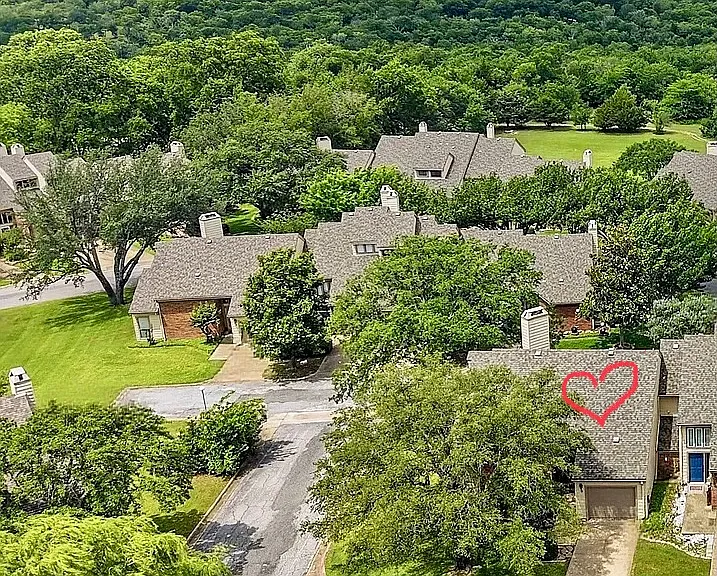 Desirable end unit affords great light. Lake Texoma is so close, you can see it from the property.