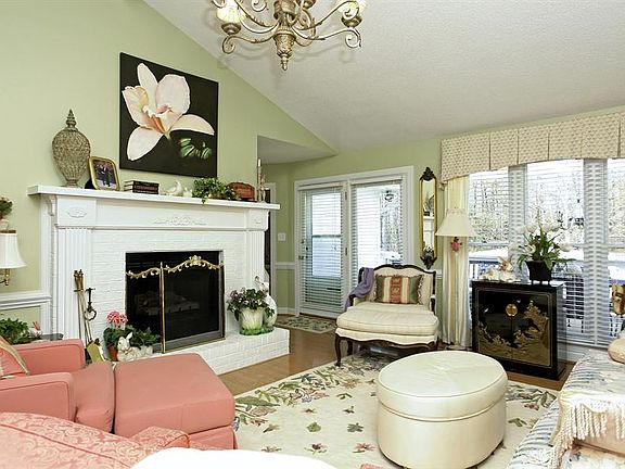 Gas log fireplace with gorgeous mantle in living room.  