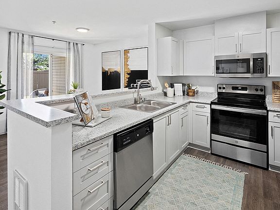 Upgraded kitchens feature new countertops, stainless steel appliances and shaker-style cabinets