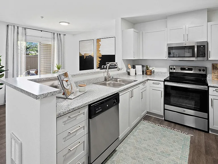 Upgraded kitchens feature new countertops, stainless steel appliances and shaker-style cabinets