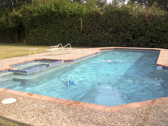 Heated pool with in-ground hot tub