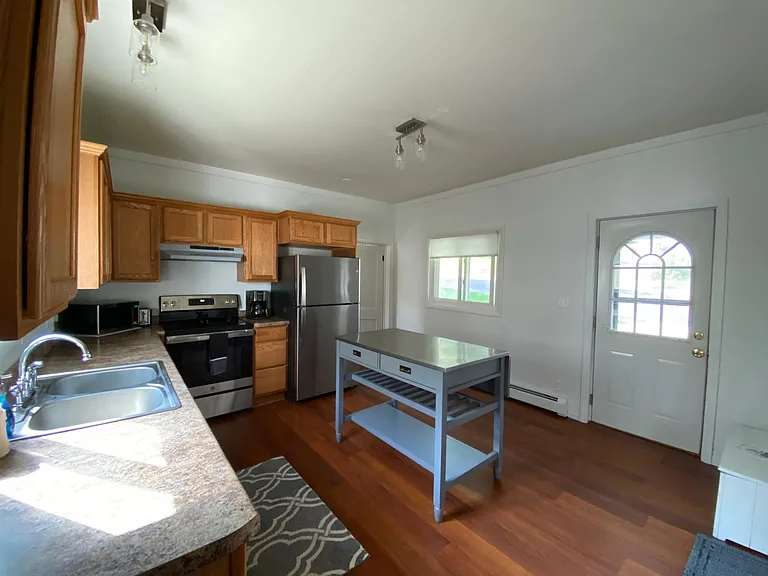 Kitchen with brand new refrigerator and stove.