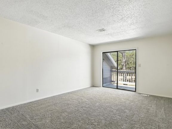 upstairs bedroom with upstairs Patio access
