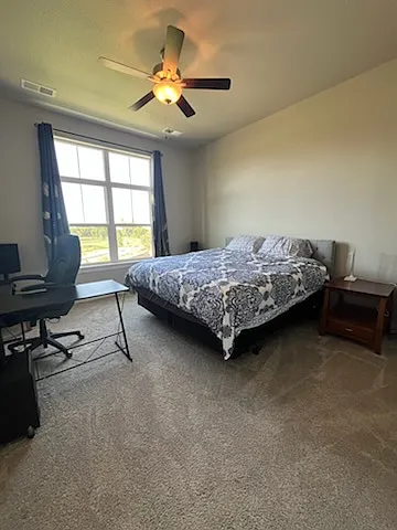 Primary bedroom suite with computer desk (desk can be removed), with golf course view