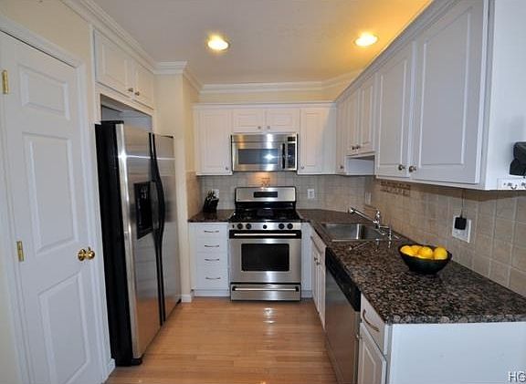 New Kitchen with Granite Counters and Stainless Steel Appliances