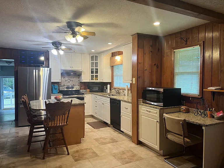large open eat in kitchen with desk work area