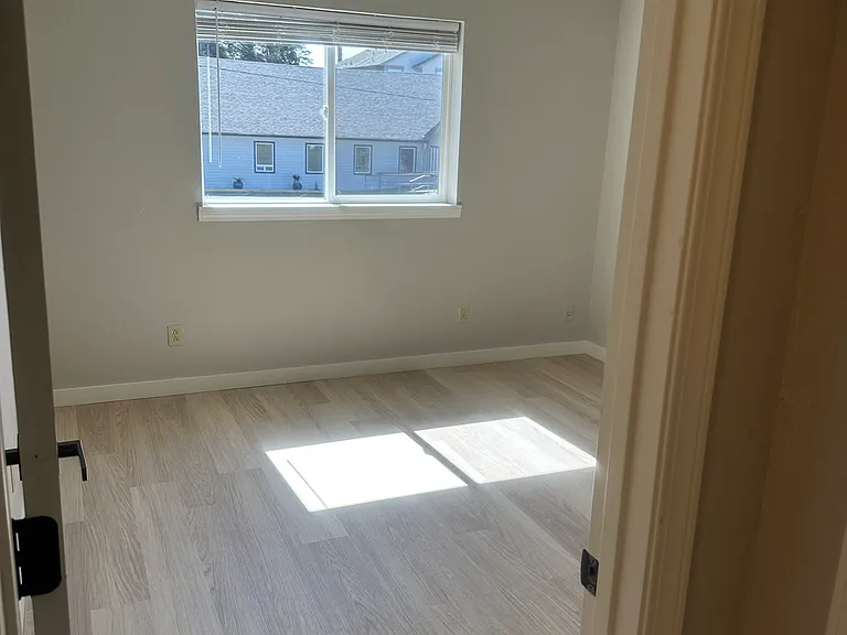 Bedroom #4 with abundant natural light, shade on the window